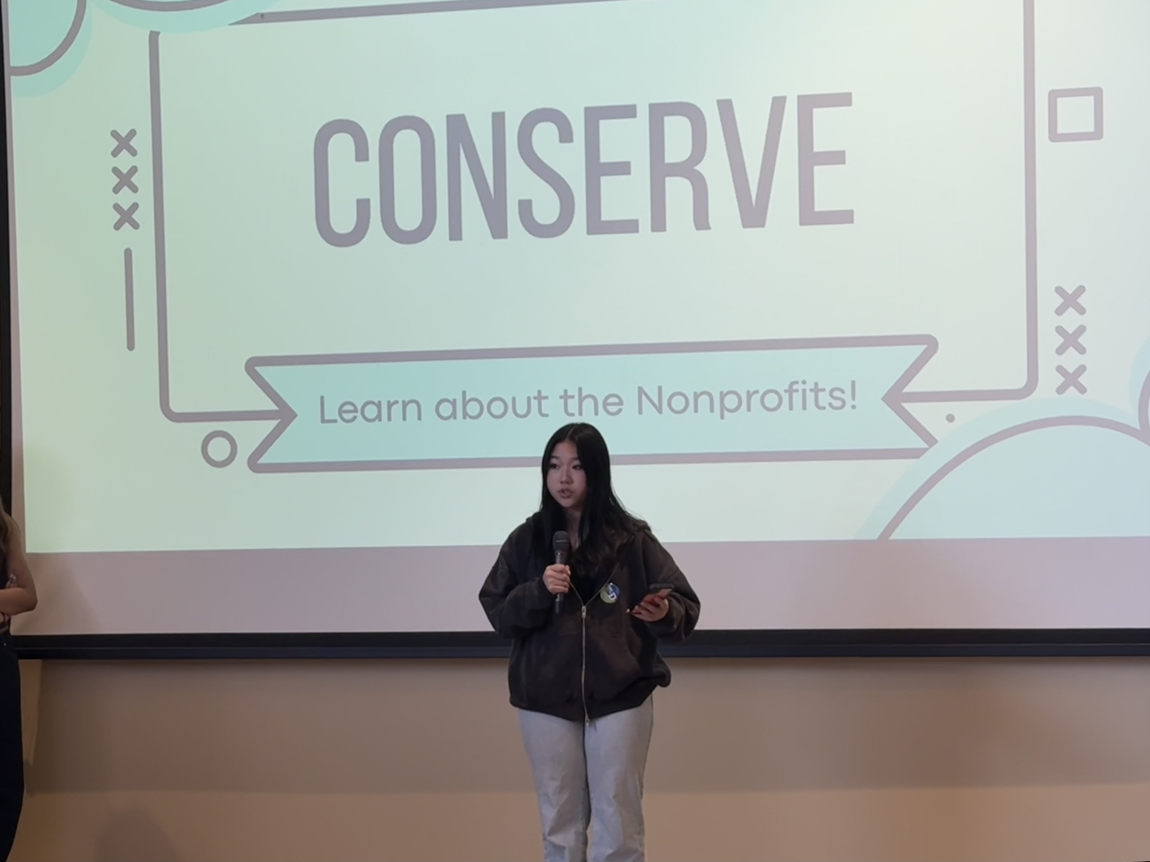 A ConServe member presenting the nonprofit at a community summit